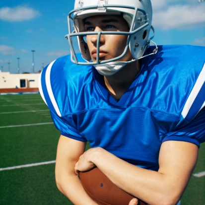 Football player carrying football