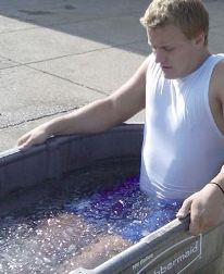 Football player in ice bath