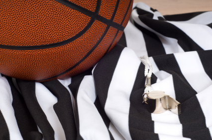 Basketball, official's jersey, and whistle