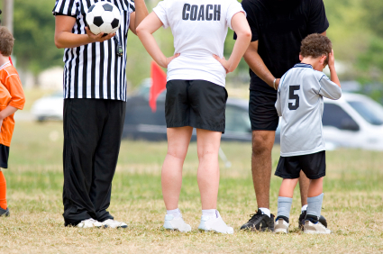 Coach, soccer ref and upset child