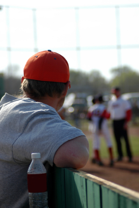 Dad watching baseball game