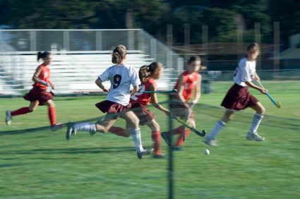 Field hockey players in action