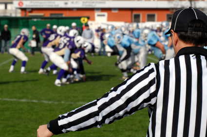 Football head linesman watching play