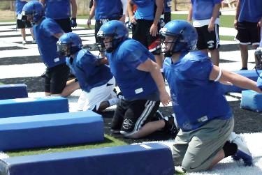 Football players practicing in the heat