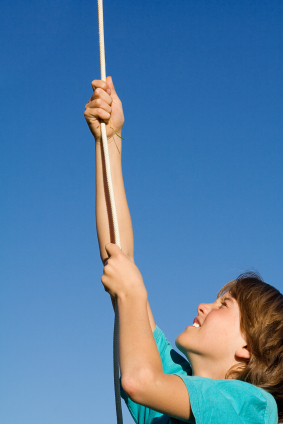 Girl climbing rope