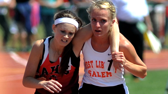 Meghan Vogel helps Arden McMath over finish line