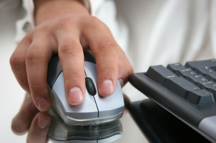 Hand on computer mouse