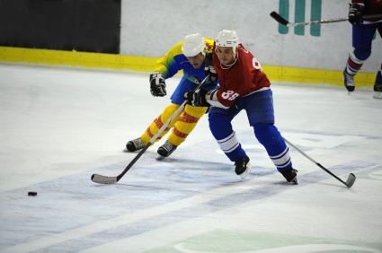 Hockey players fighting for puck