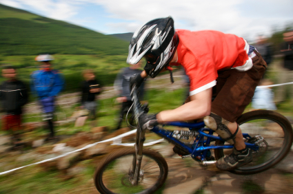 Mountain biker heads down course