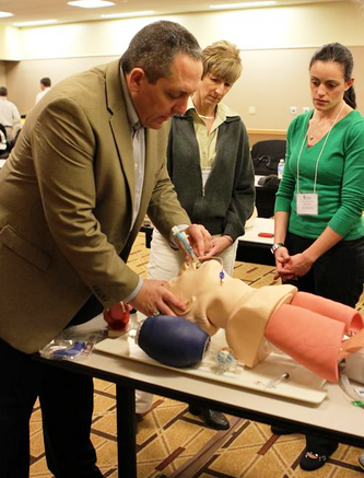 Robb Rehberg demonstrating treating patient with head injury