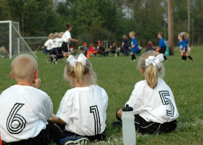 Young soccer players on bench