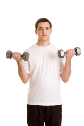 Teenage boy with small dumbells