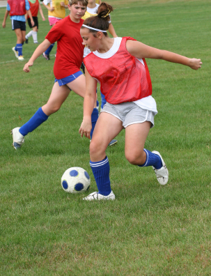 Teenage girls playing soccer