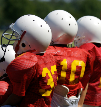 Three young football players