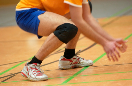 Volleyball player ready to dig for ball