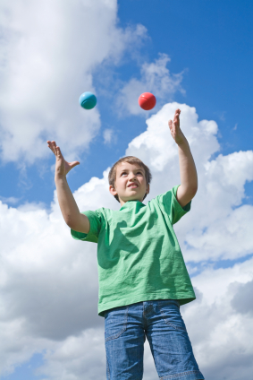 Boy juggling balls