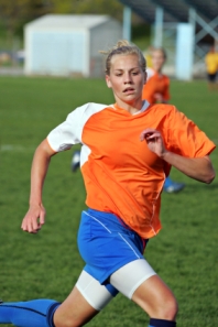 Female soccer player running