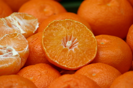 Sliced and whole oranges