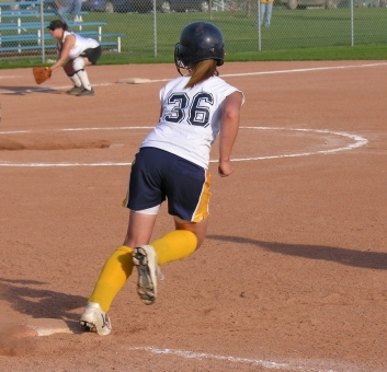 Sofball player running bases